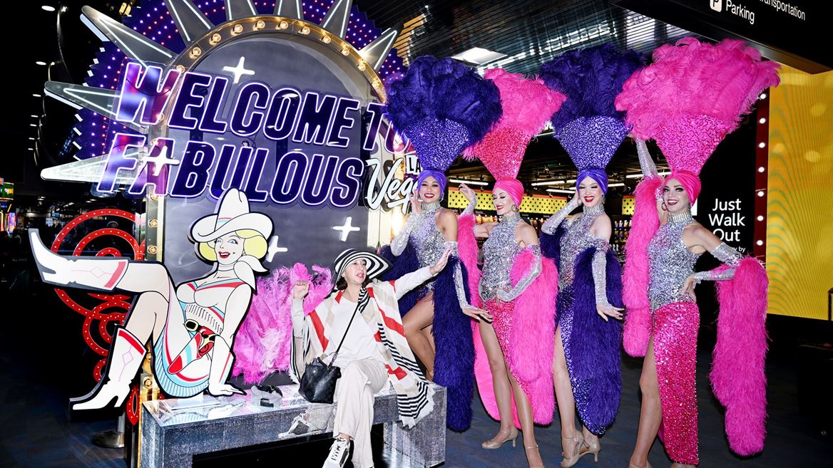 Showgirls With Visitor Taking Photo