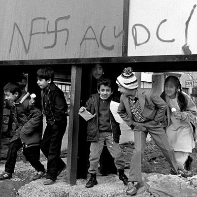 British Asian Children Under Hoarding Bradford 1980s From the Migration Museum s All Our Stories exhibition