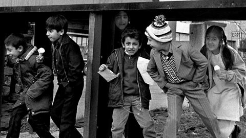 British Asian Children Under Hoarding Bradford 1980s From the Migration Museum s All Our Stories exhibition