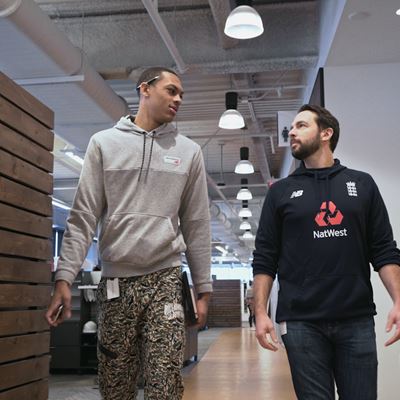 Darius and Pat Walking the Halls at New Balance HQ