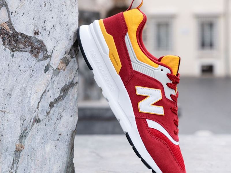 red and yellow new balance shoes