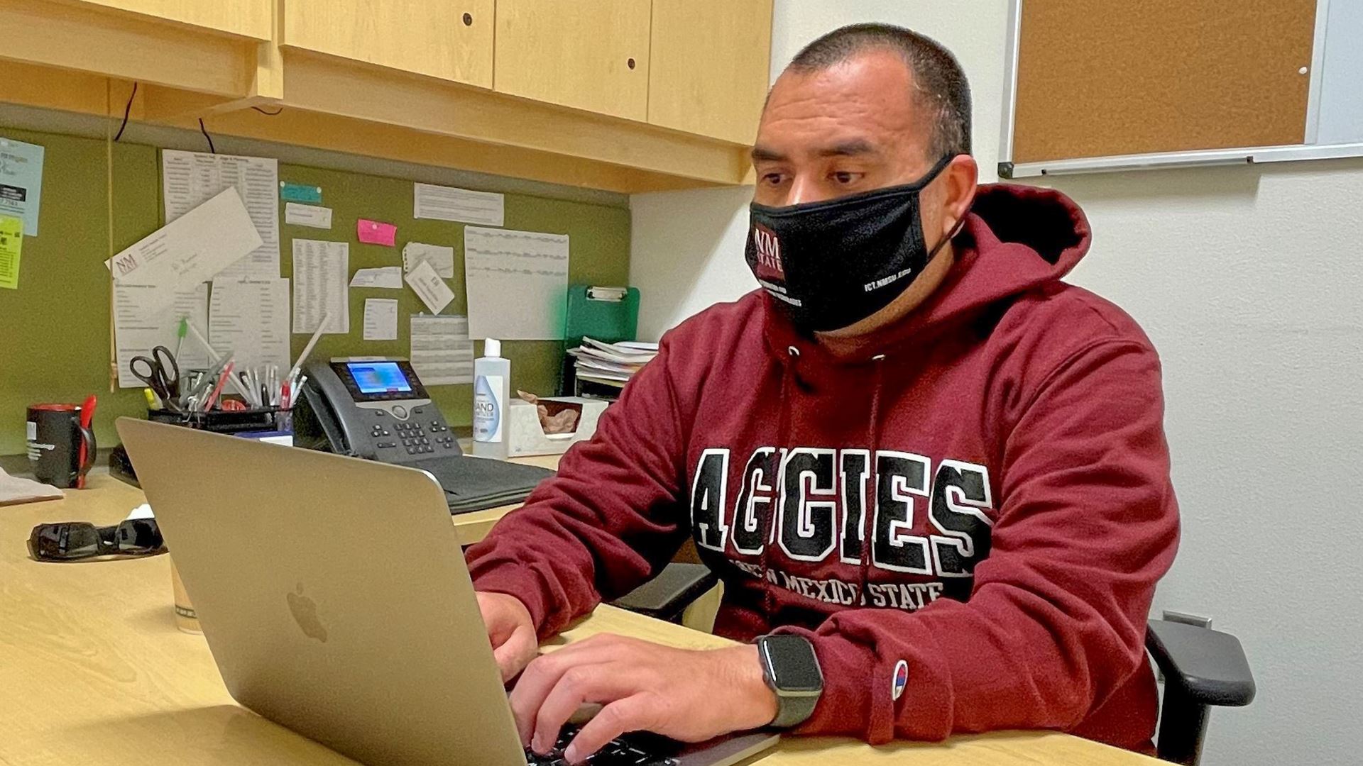 New Mexico State University information technology graduate student Eli Ramos programs a mobile application. (Courtesy p
