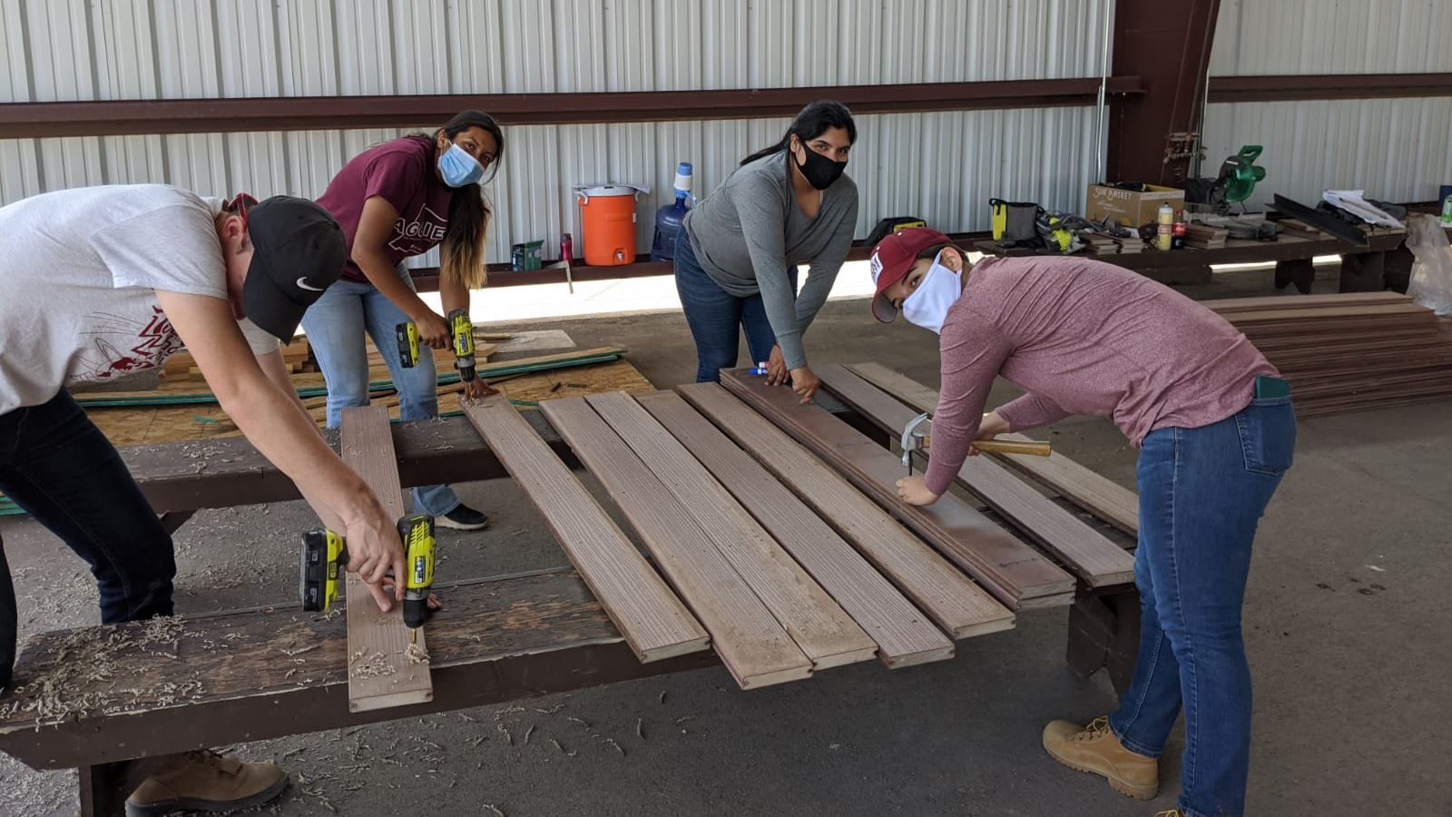 Aggies Without Limits students prepare the bridge deck for the Otero County Fair pedestrian bridge. (Photo courtesy AWL)