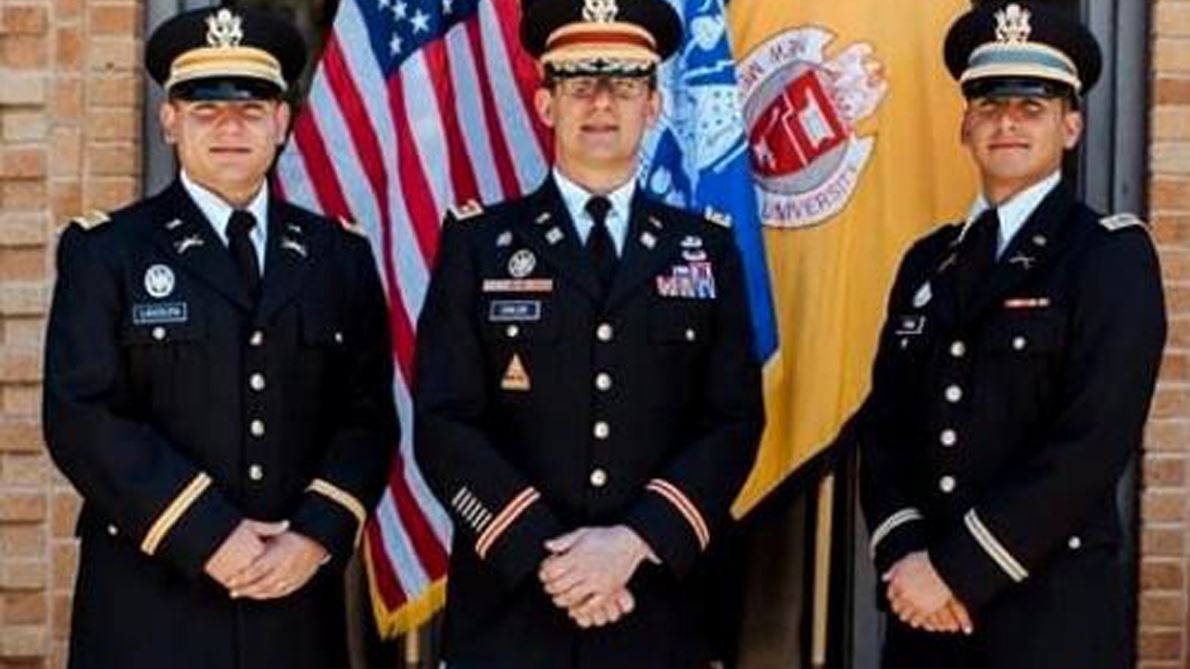 Three men in military uniform Newly commissioned officers 2nd Lt. Dominic LaVolpa, left, and 2nd Lt. Luis Pena with Lt.