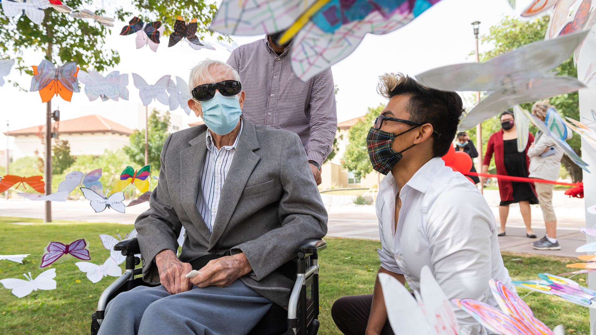 Artist Jesus Del Rio with J. Paul Taylor at the entrance to “Mariposas Campesinas” at the College Assistance Migrant Pro