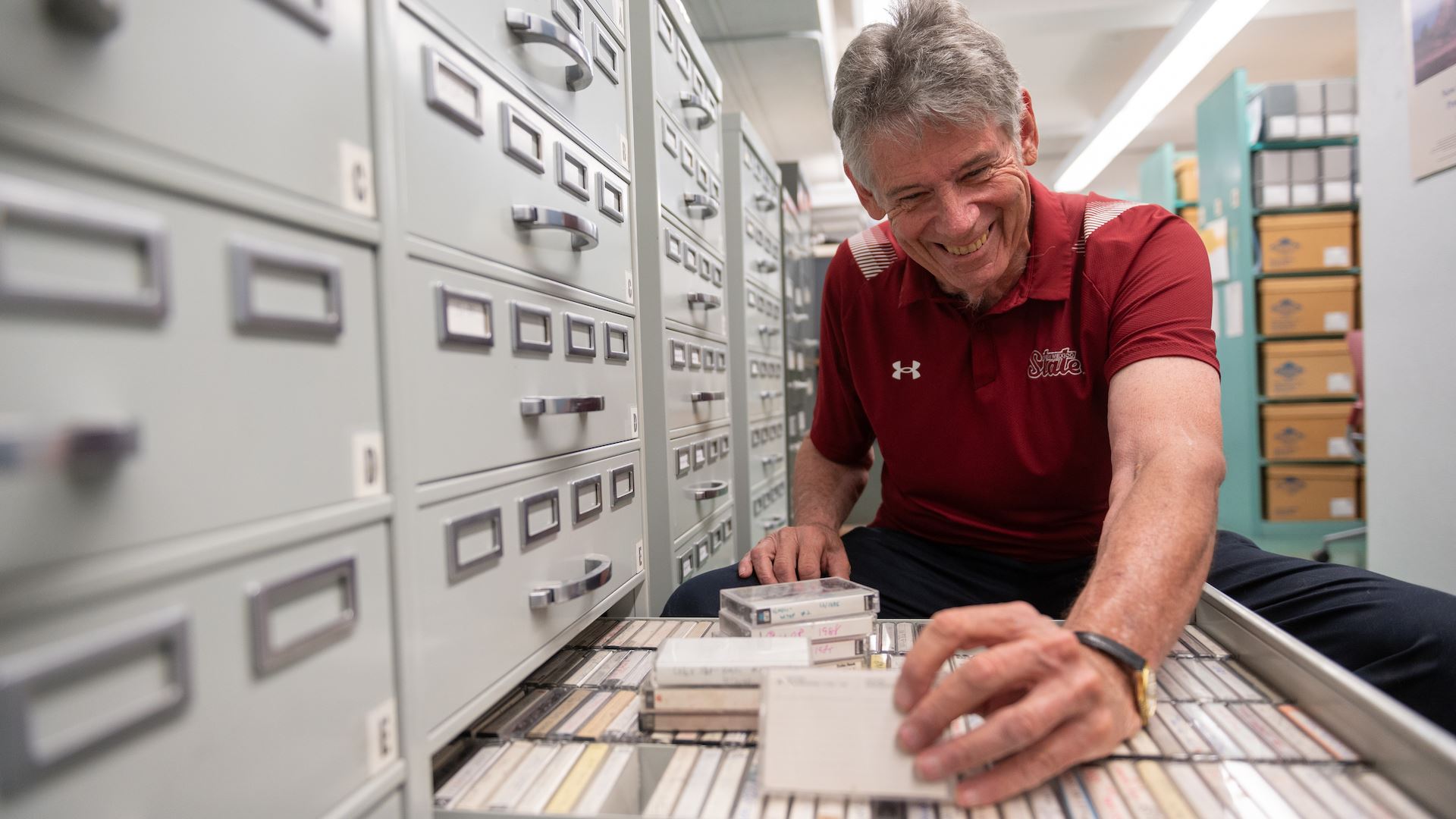 Photo of Jack Nixon at Branson Library s Archives and Special Collections sorting donated tapes