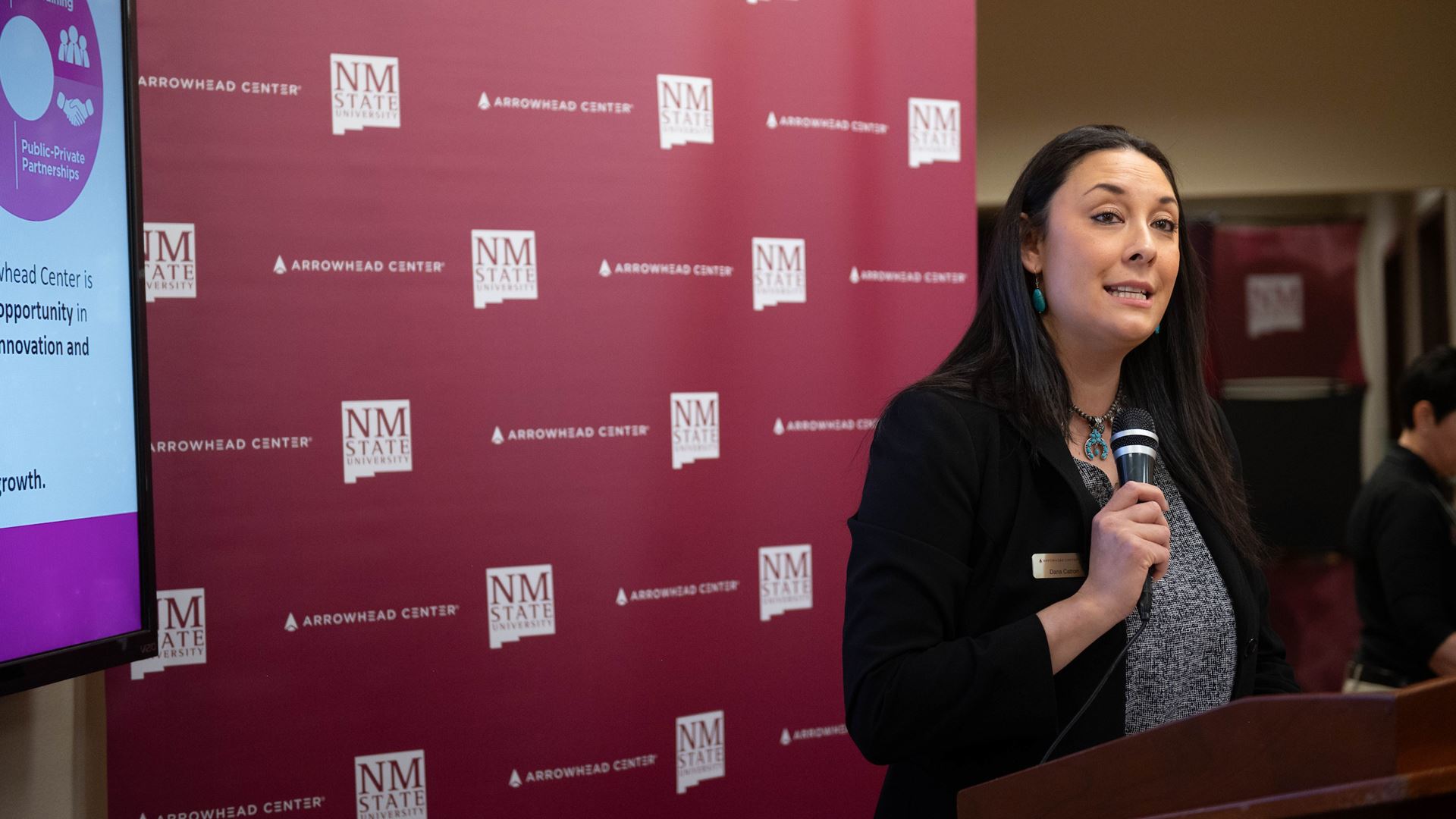 Woman speaking at a podium