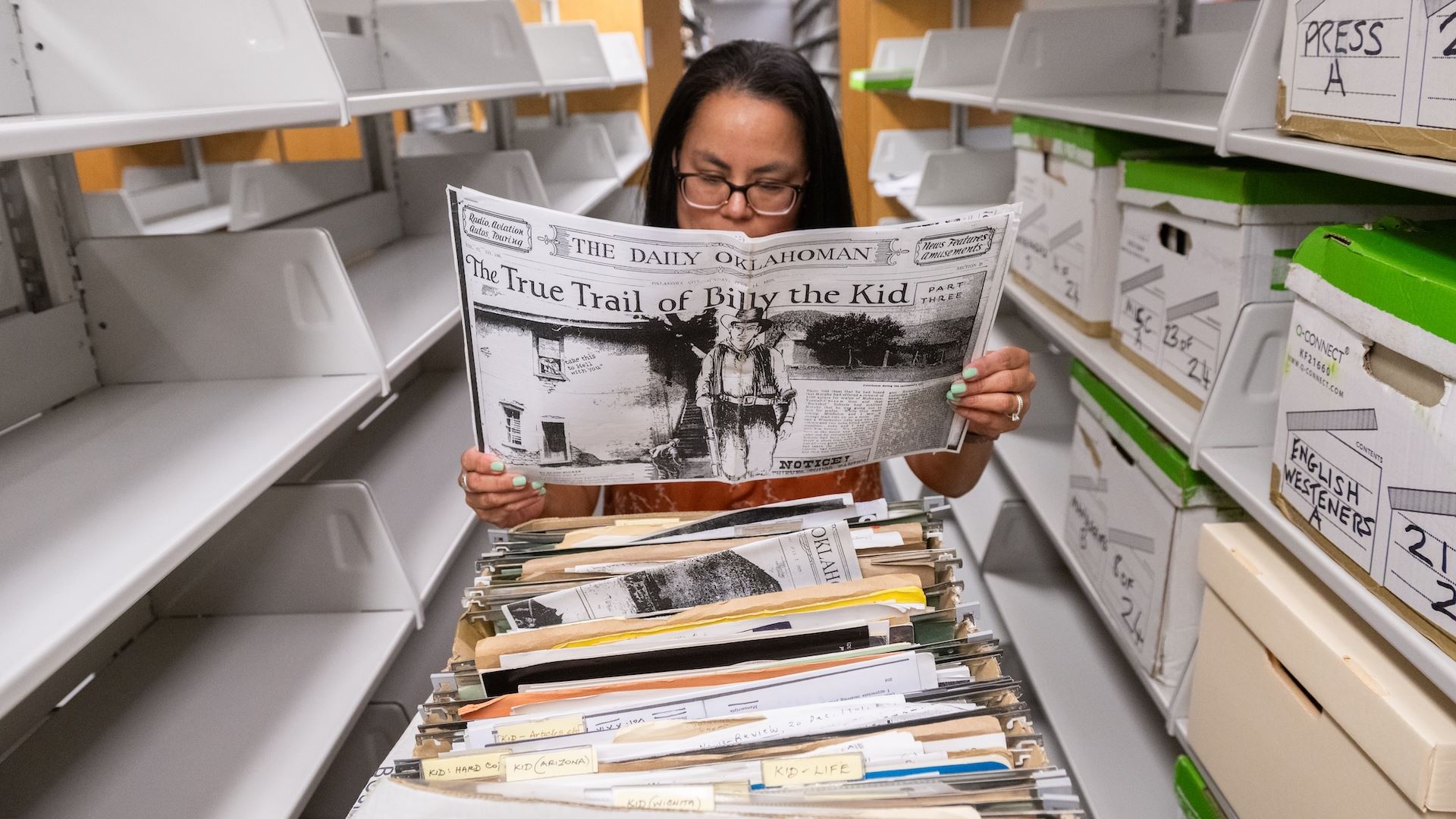 Photo of Jennifer Olguin archivist at NMSU s Archives and Special Collections with Frederick Nolan papers Aug 2025