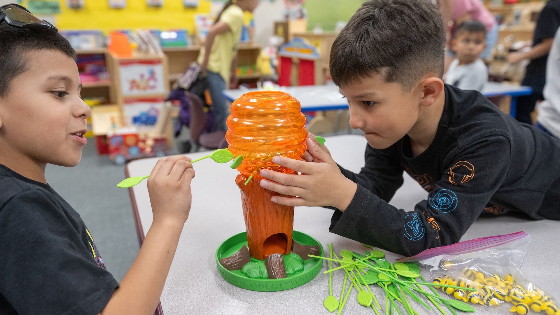 IMAGE DESCRIPTION Two boys assembling a plastic tree