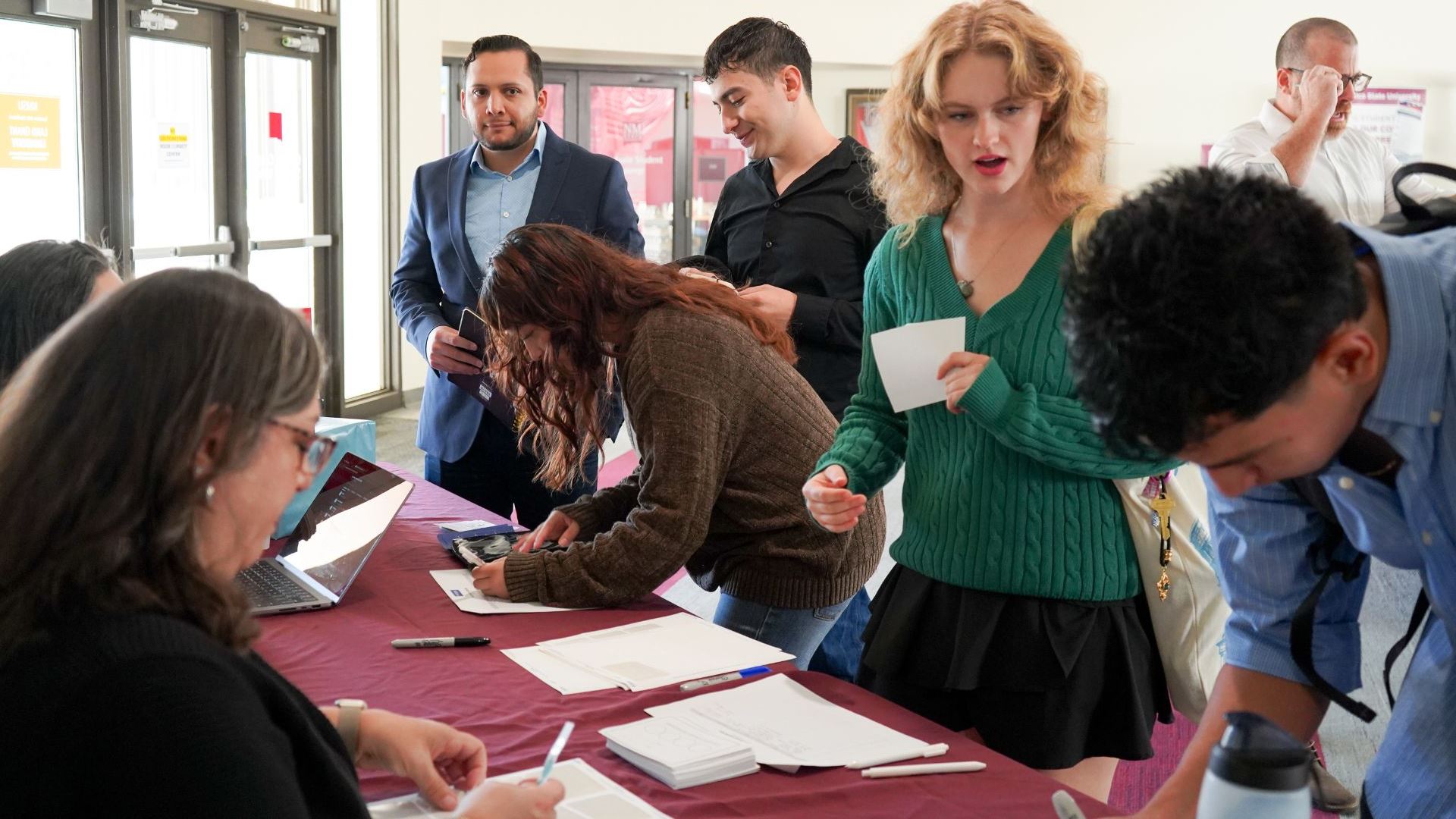 Photo of students checking in at the Bold Idea Conference