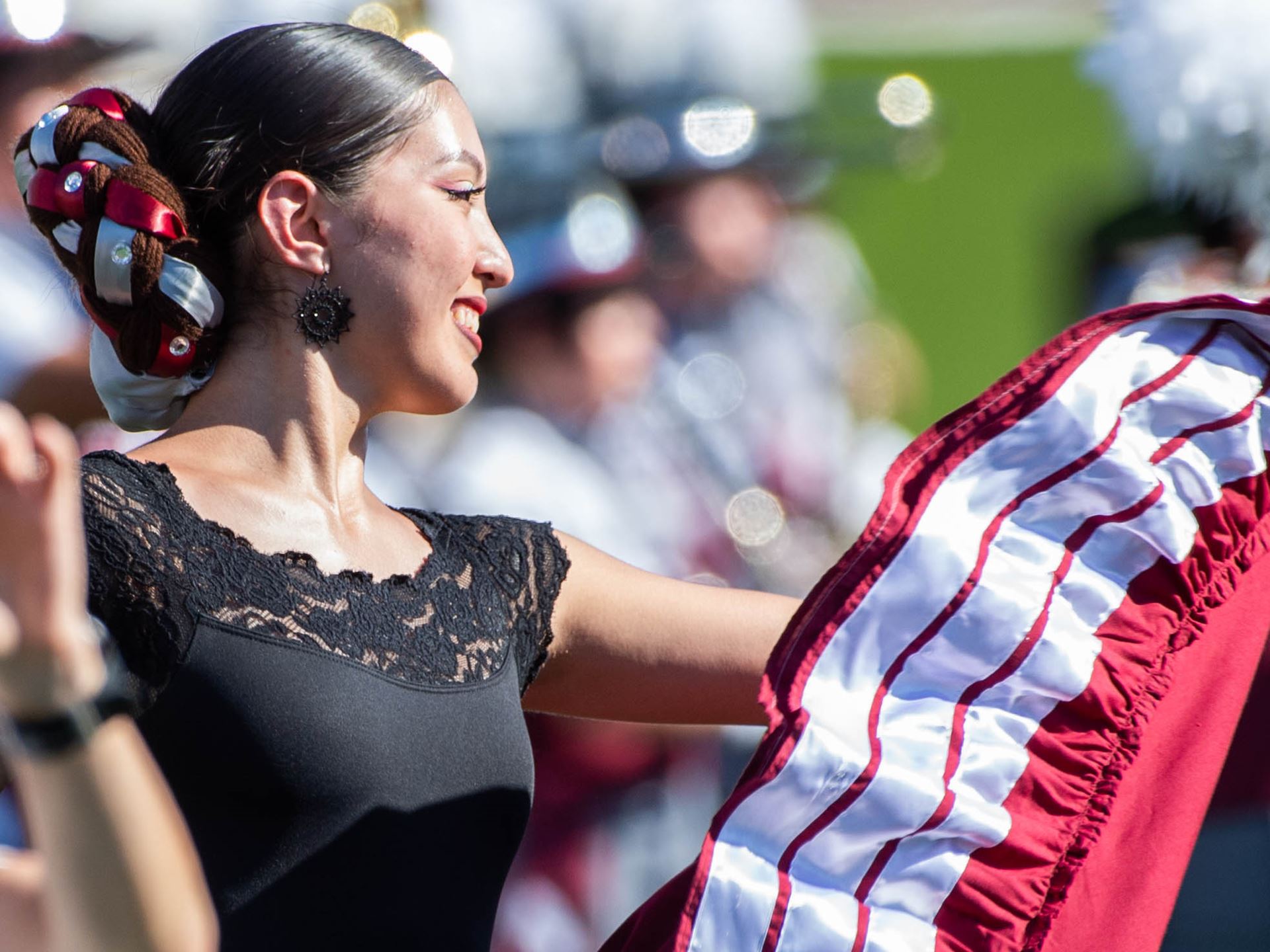 New Mexico State University Folklorico dancer at football game