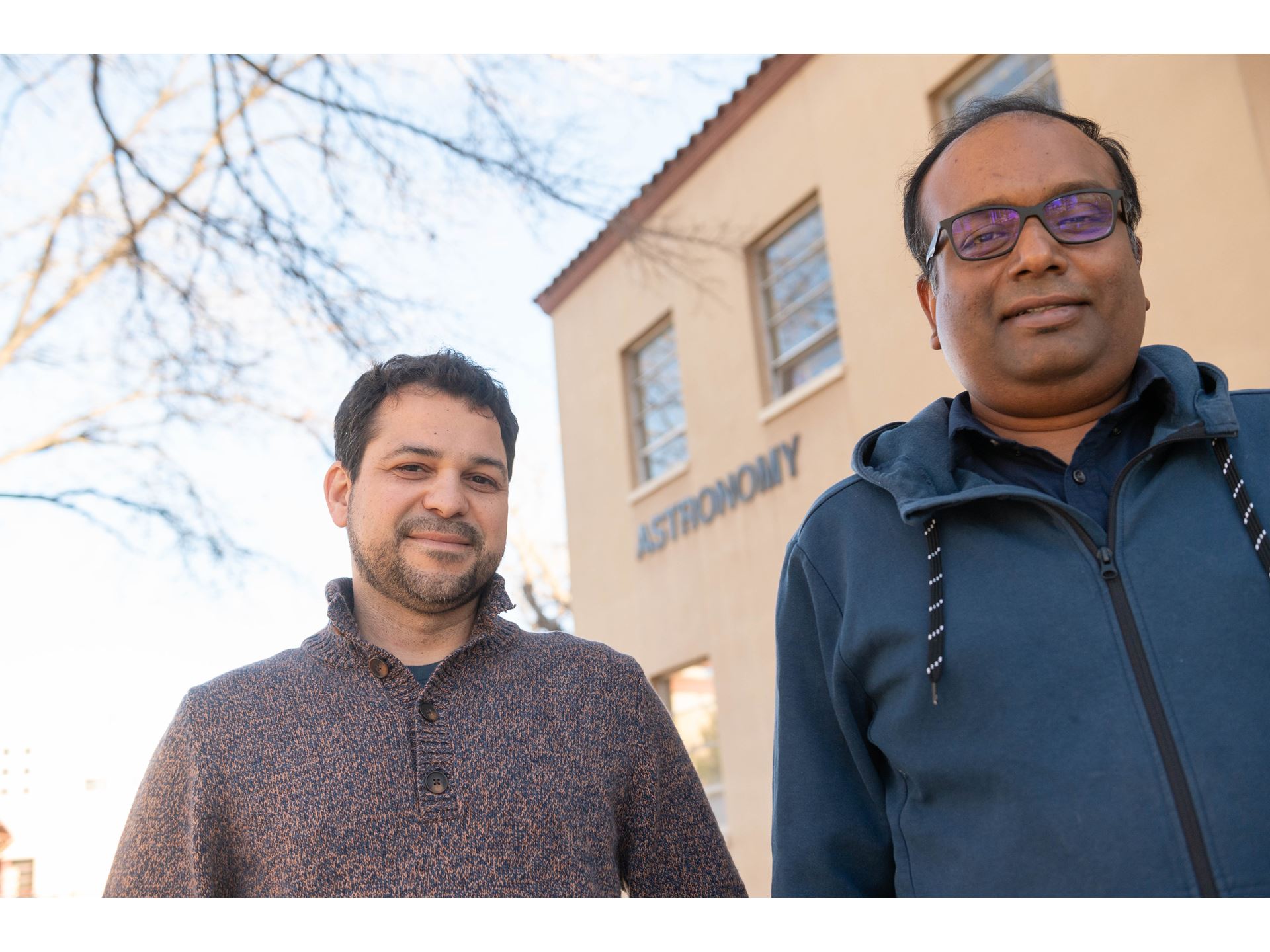 Two men in front of a building