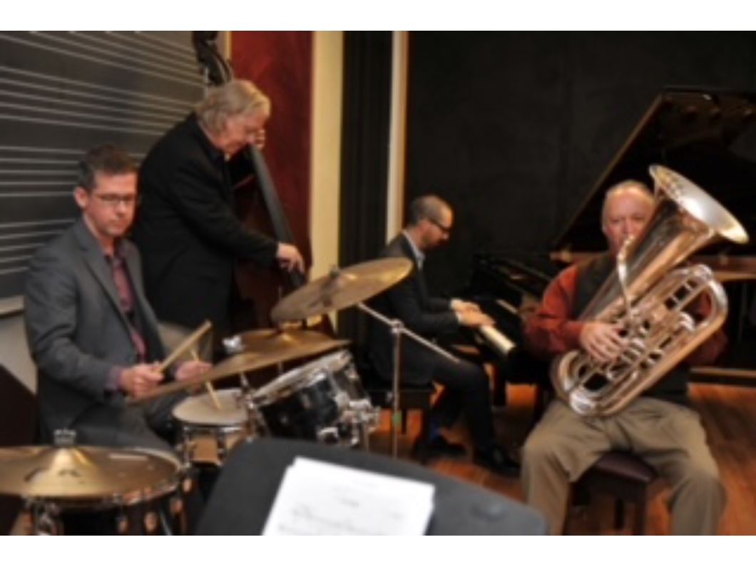 Four men with instruments