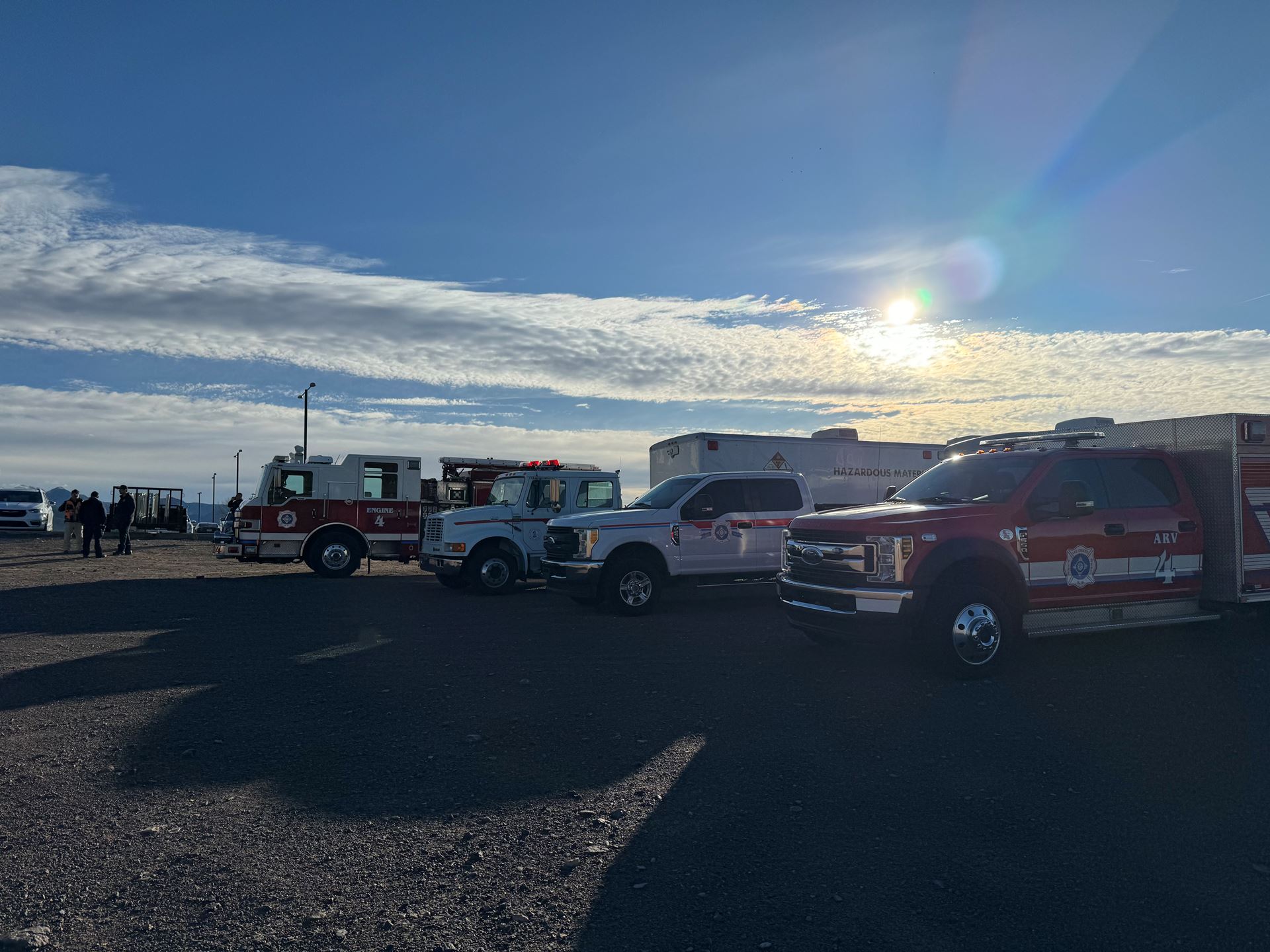 Emergency vehicles parked in a parking lot
