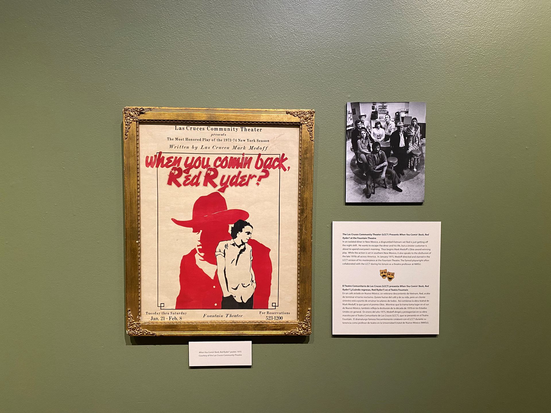 Poster and photo on a wall