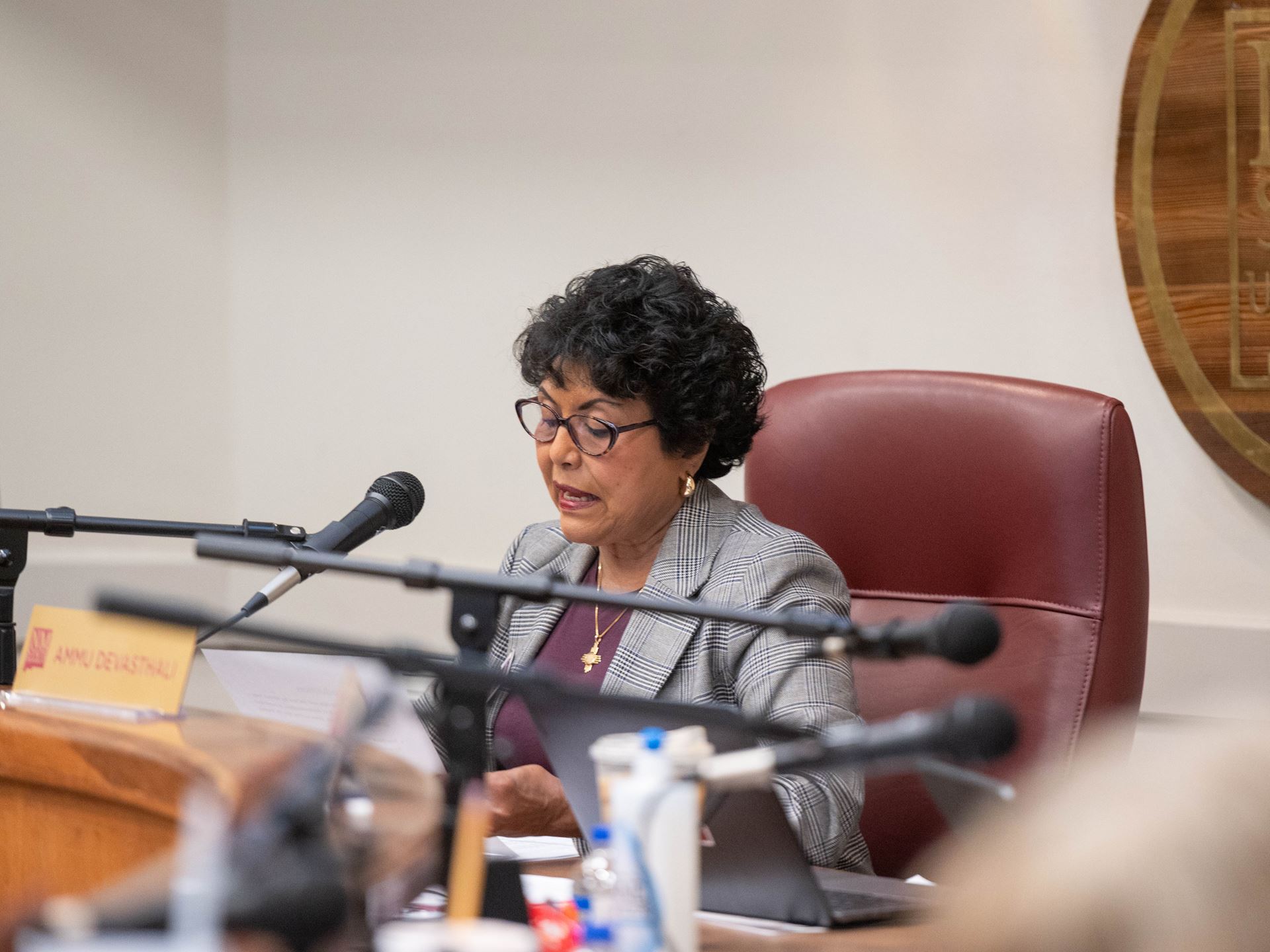 Woman speaking into microphone