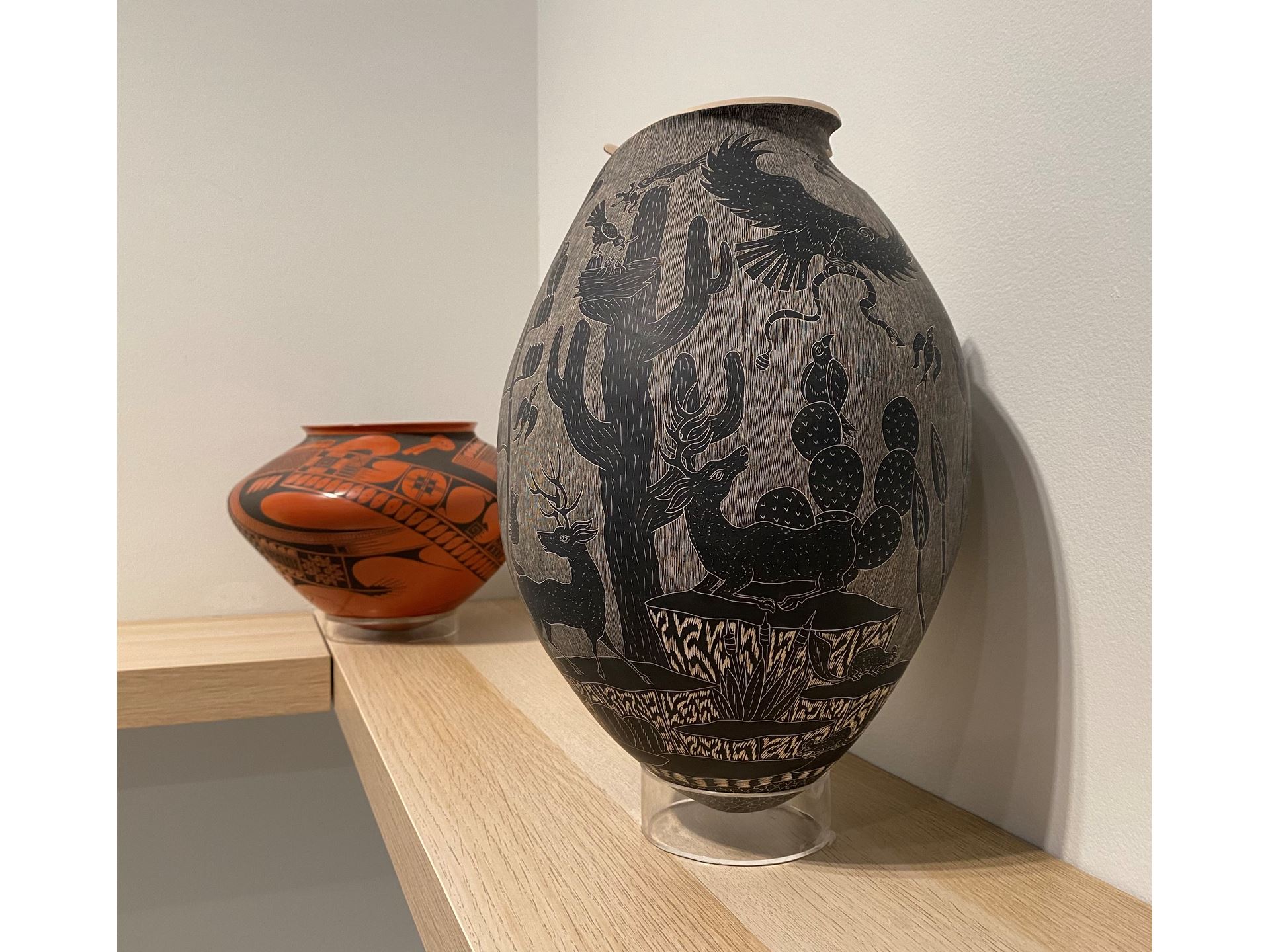 Two pieces of pottery on a shelf