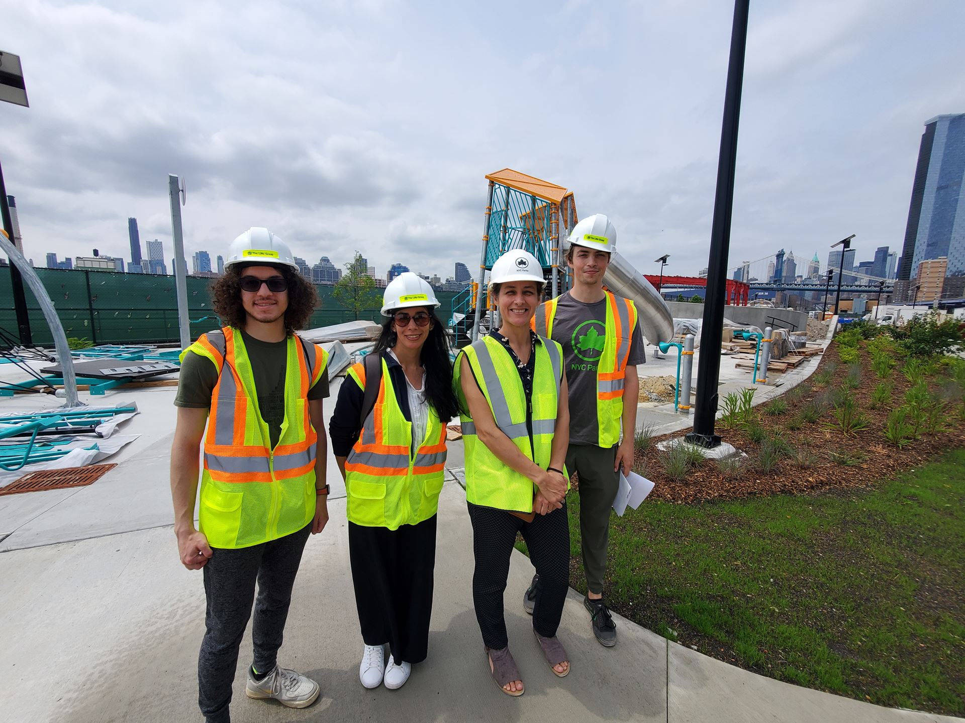 Four people on a construction site
