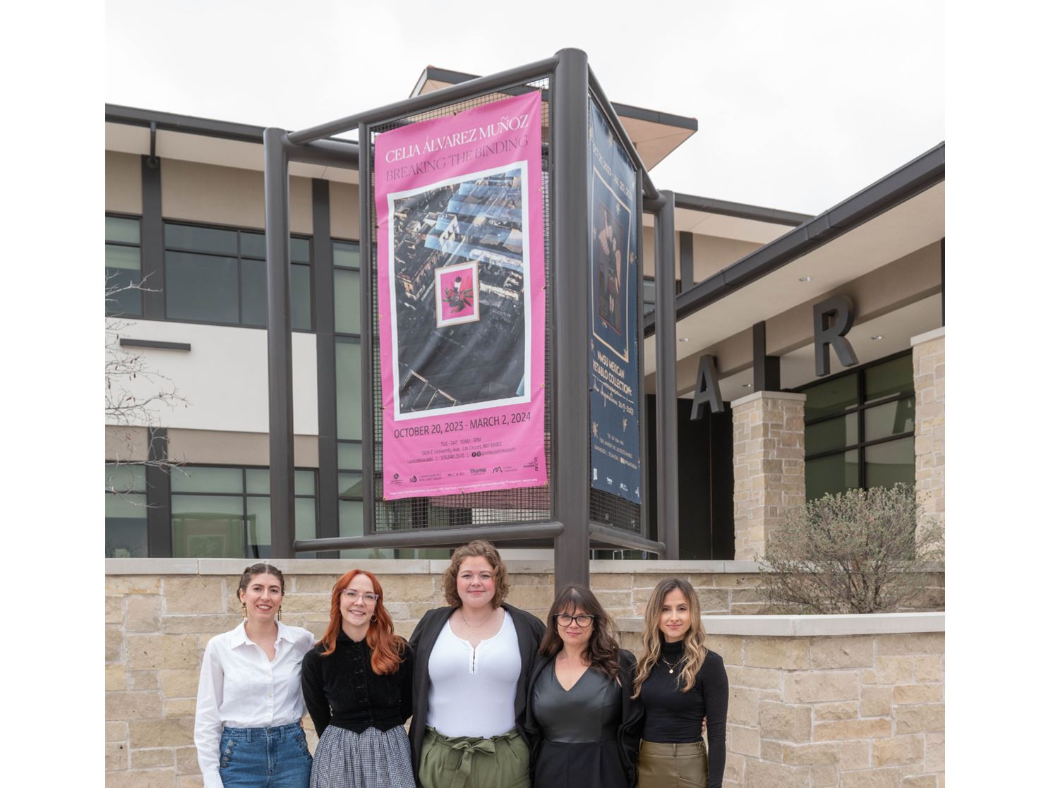 Five women standing together