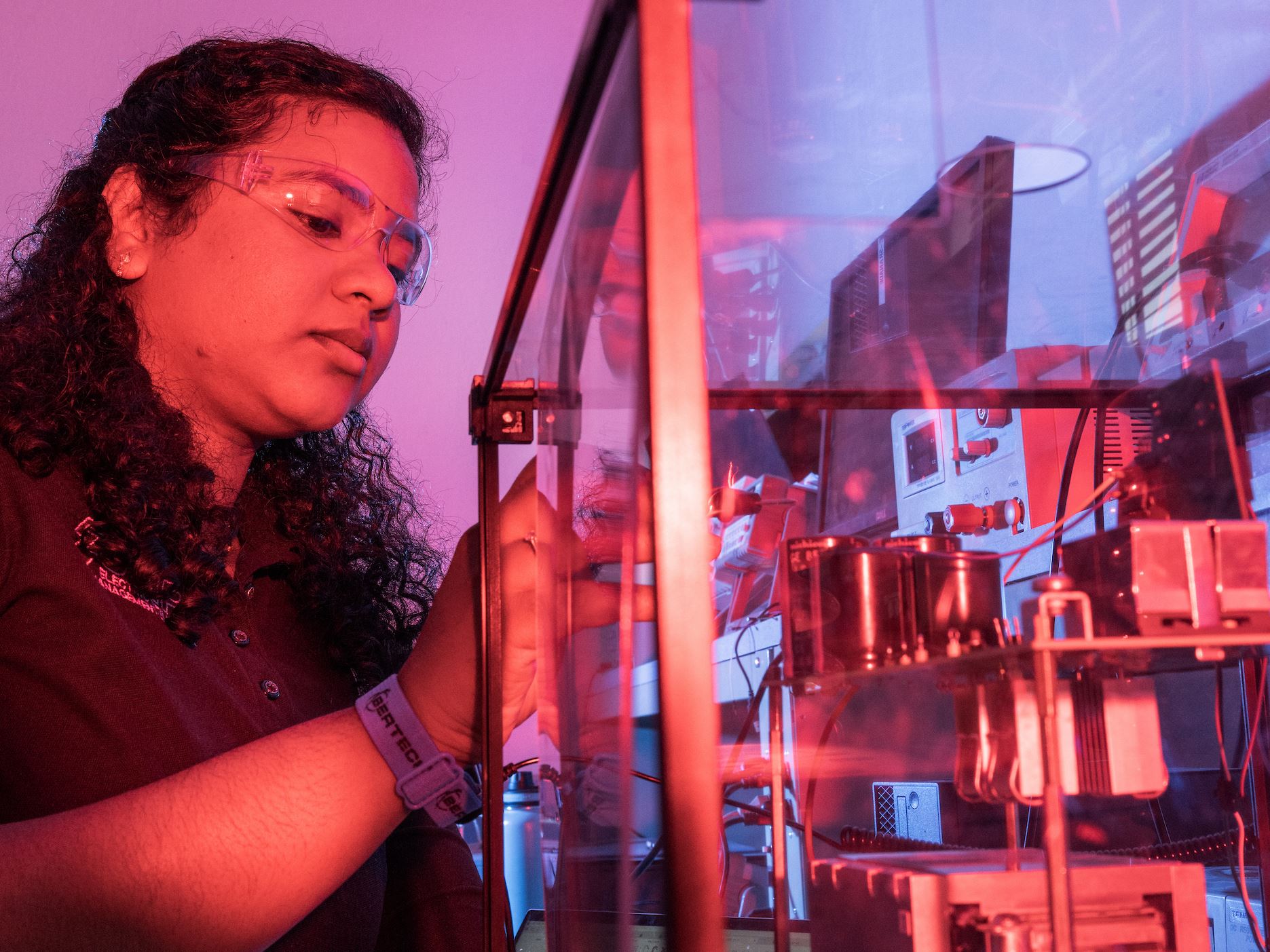 IMAGE DESCRIPTION Woman standing next to electrical equipment