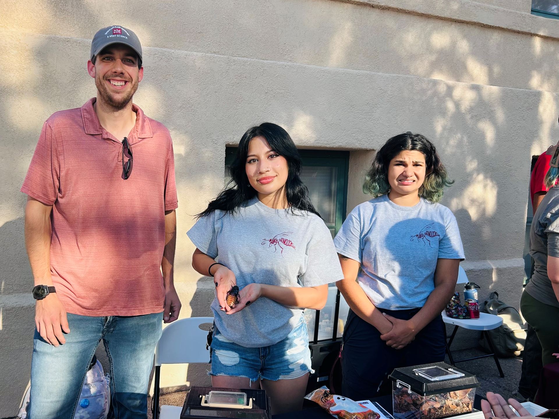 Photo of Alexis Olmos doing outreach at NMSU with the Entomology Club