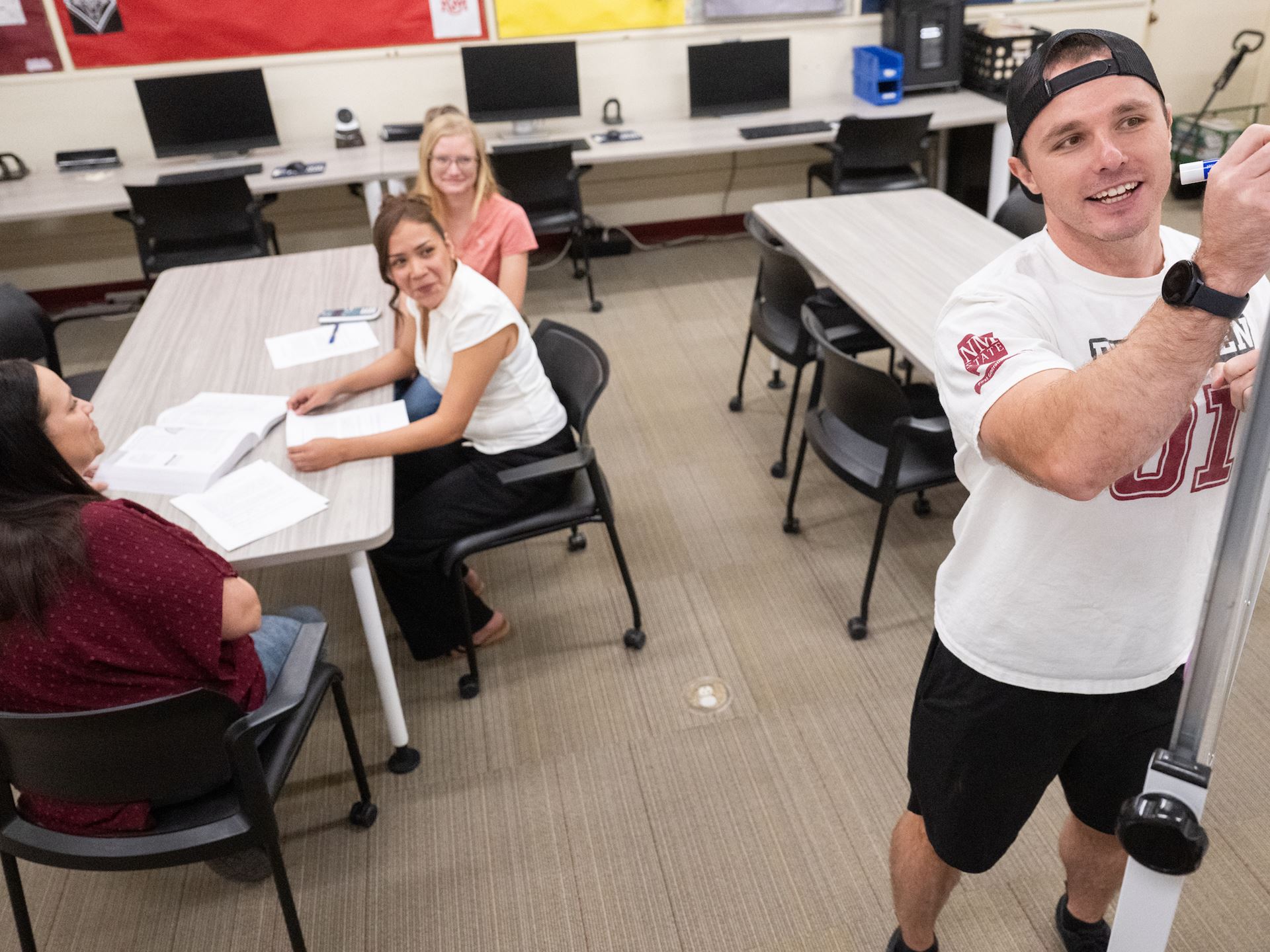 Photo of Blade Morris giving instruction to Adult Education students at the NMSU Grants campus