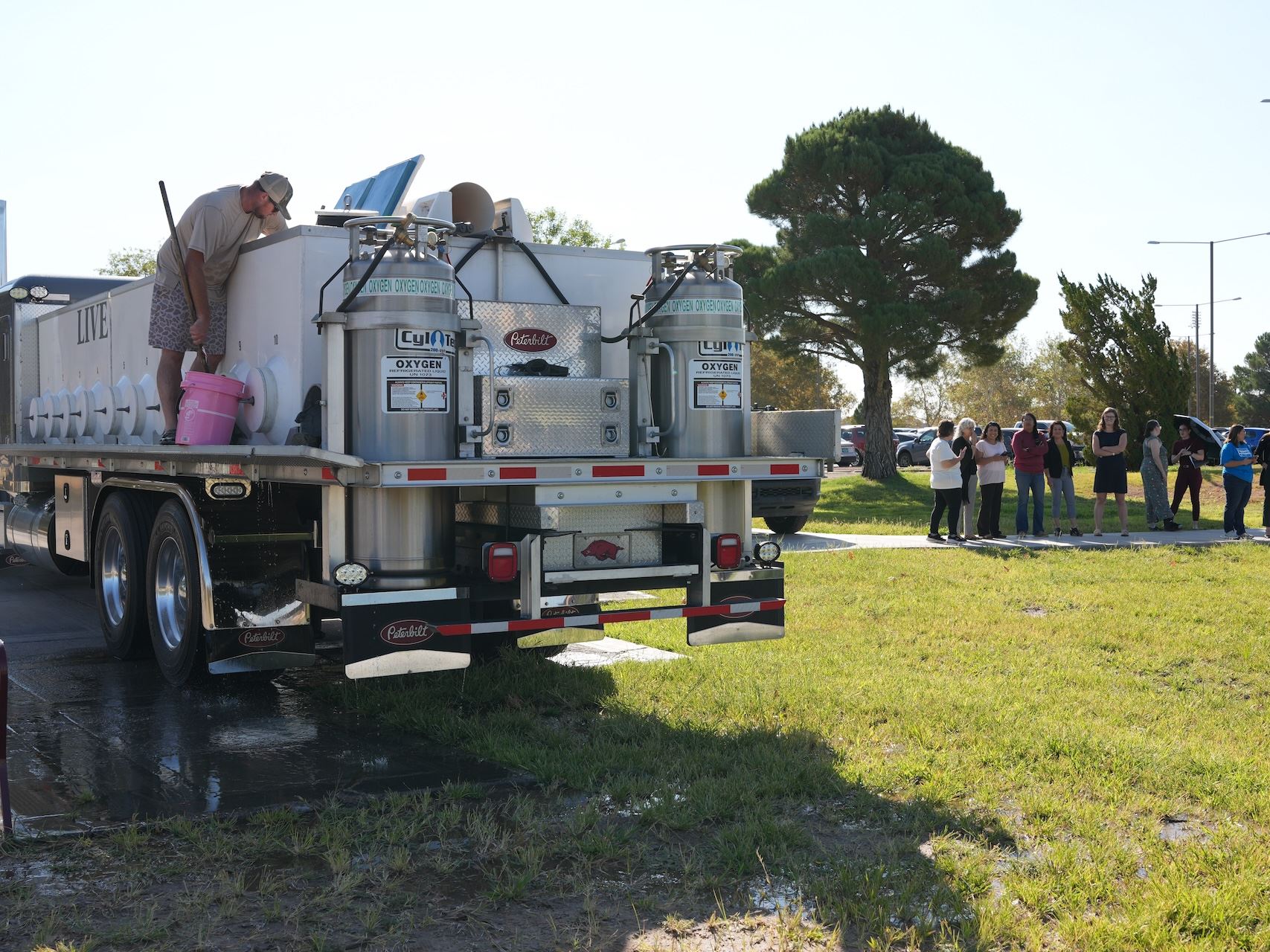 Photo of first fish stocking at Alumni Pond