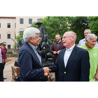 New Mexico State University Chancellor Dan Arvizu, left, shares a laugh with Nusenda Credit Union President and CEO Joe