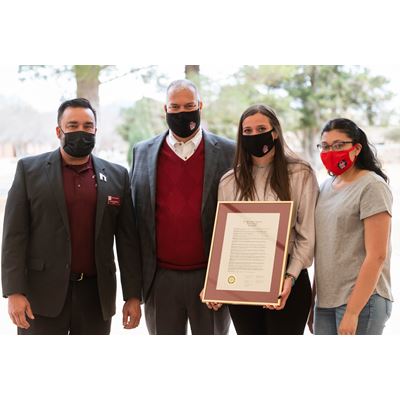 NMSU Regent Arsenio Romero, left, stands with Ben, Tavyn and Taralyn Trujillo after reading a proclamation in honor...