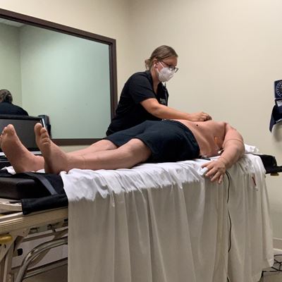 Katie Gimbel, a clinical assistant professor at St. Ambrose University in Iowa, demonstrates a physical assessment...