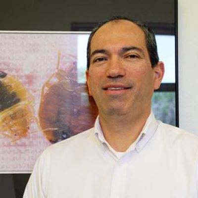 Alvaro Romero, associate professor of urban entomology at New Mexico State University, will lead a new cross-campus coll