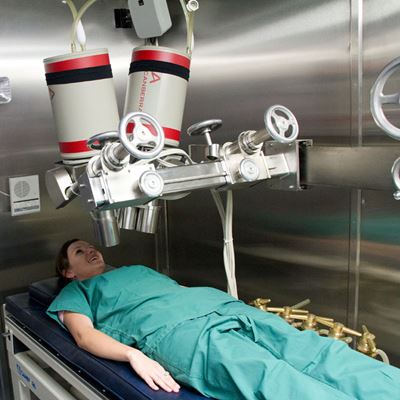 A volunteer performs a lung and whole-body count at Carlsbad Environmental Monitoring and Research Center’s Internal Dos