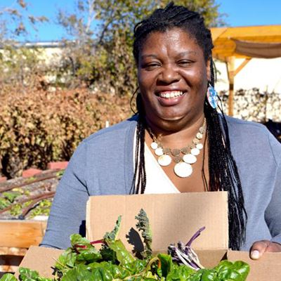 Jamilah Murray, a member of the Rio Grande Food Project community garden, enjoys harvesting and tasting vegetables that