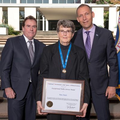 Reta Beebe stands with Michael Watkins, director of NASA’s Jet Propulsion Laboratory in Pasadena, California (left), and