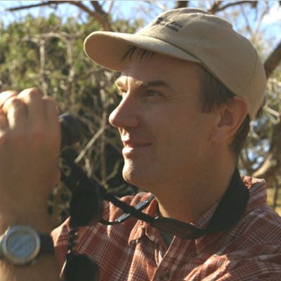 Biology professor collaborates with NMSU alumni in ongoing parrot research