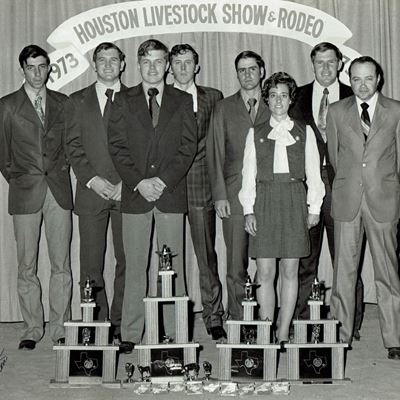 Photo of Neil Burcham with students at Houston Livestock Show & Radio