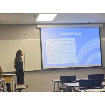 A student giving a presentation in a classroom