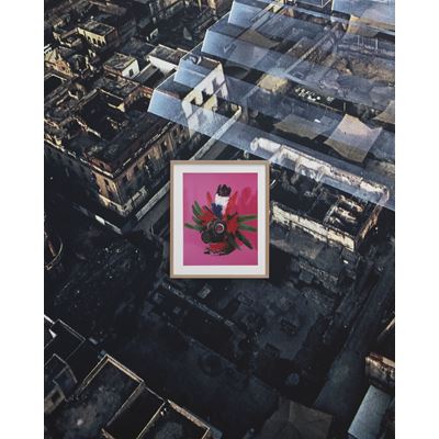 Framed pink print against a city background