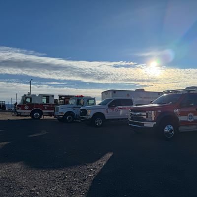 Emergency vehicles parked in a parking lot