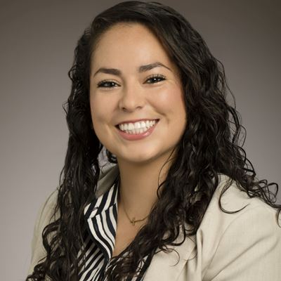 Portrait of smiling woman with brown curly hair