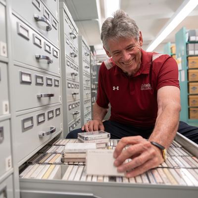 Photo of Jack Nixon at Branson Library s Archives and Special Collections sorting donated tapes