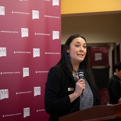 Woman speaking at a podium