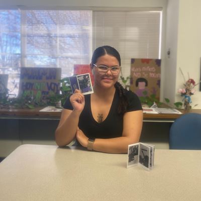 Photo of Destiny from Women in STEM League WSL with a zine