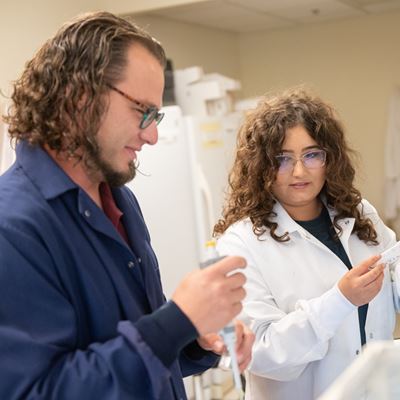 IMAGE DESCRIPTION A man and a woman working in a science laboratory