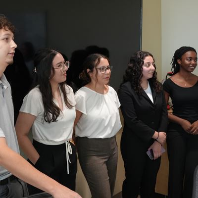 Photo of GM top executives speaking with College of Business supply chain program students