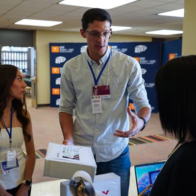 IMAGE DESCRIPTION A man speaking to three people
