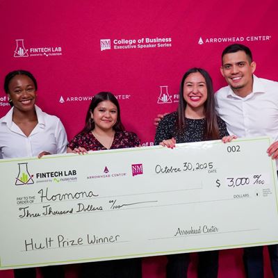 Photo of NMSU students Sydnee Johnson Alyssa Hernandez and Melissa Torres alongside Carlos Cuesta