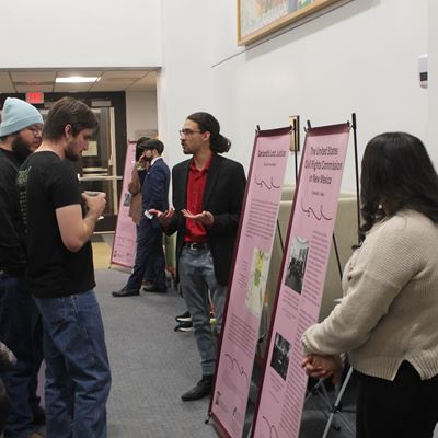 Photo of students at Branson Library presenting Black histories spotlight archival exhibit 2025