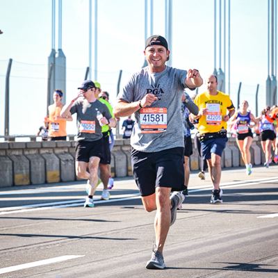 Photo of Henry Stetina running the TCS New York City Marathon in support of PGA REACH