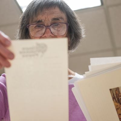 Photo of Lee Byrd looking through Bobby Byrd s collections at NMSU Archives and Special Collections